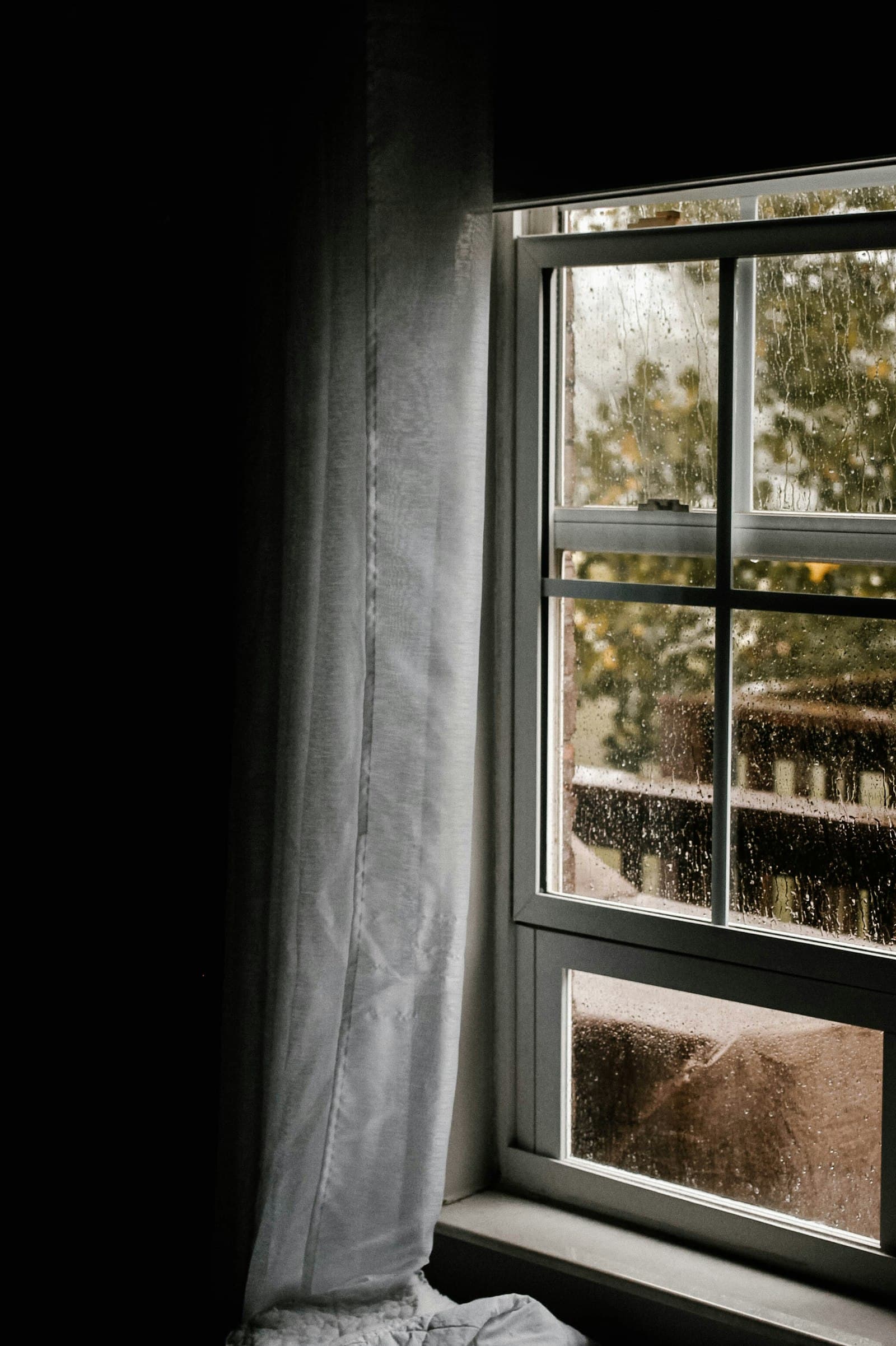Condensation beading on sliding window glass