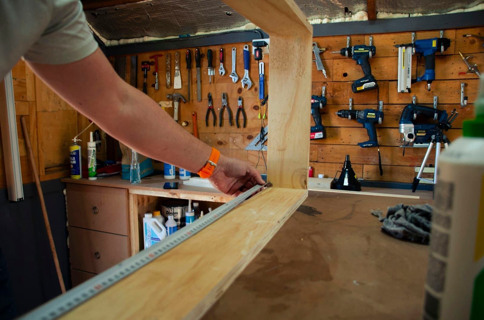 Carpenter holding a wooden window frame