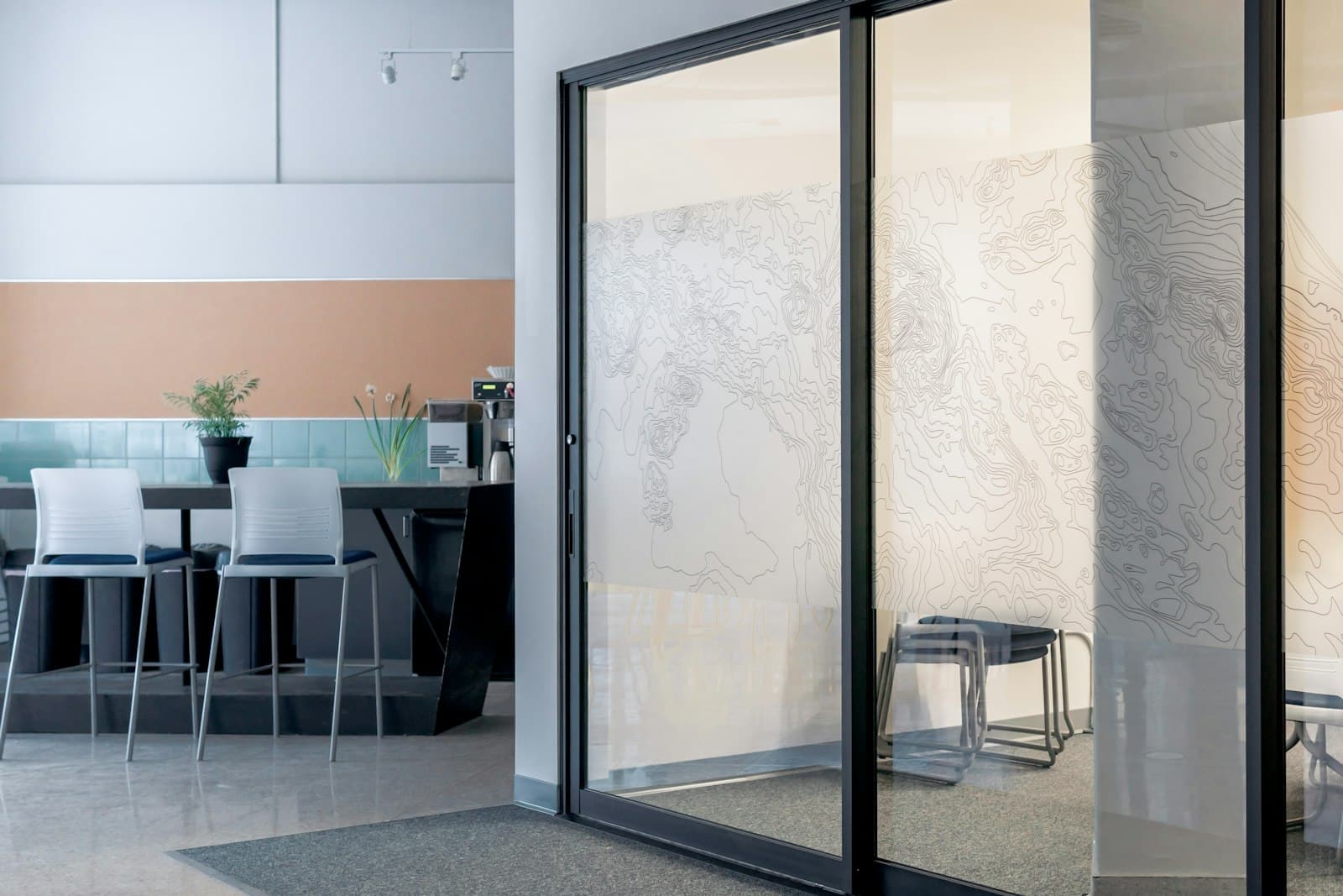 Modern sliding door beside a bright interior wall